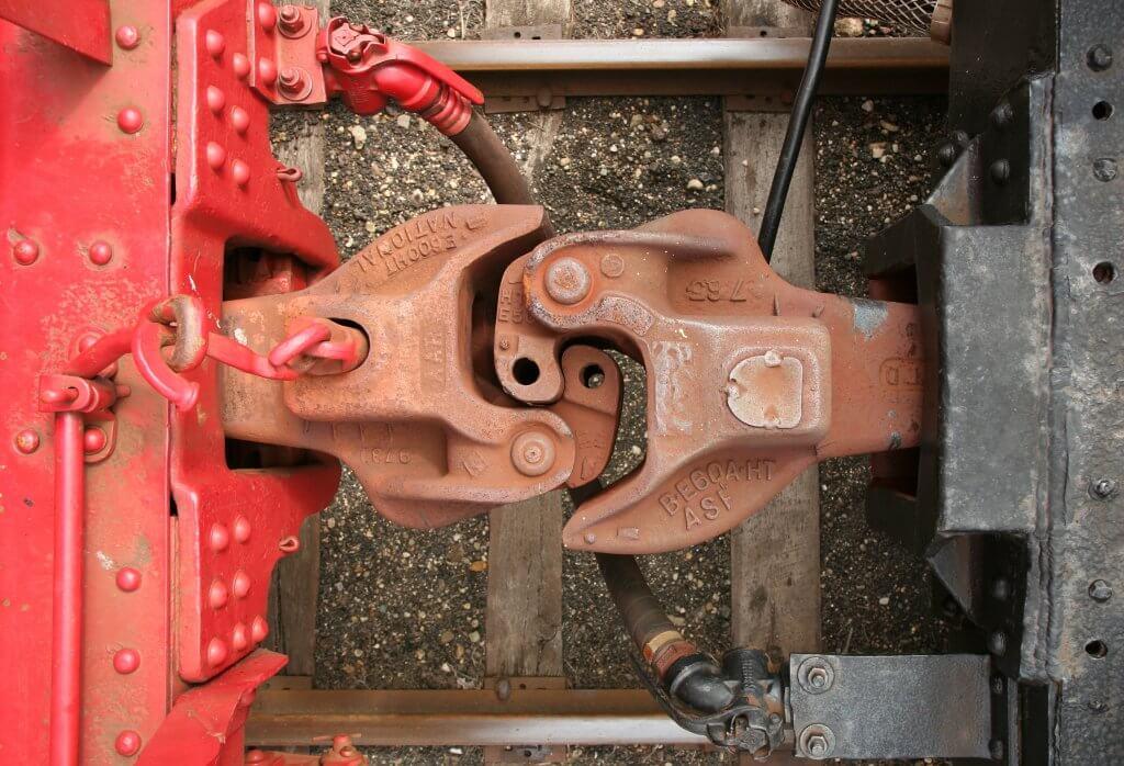 Train cars coupling brackets connected together